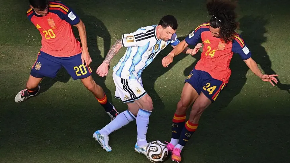 Marc Cucurella tackles Lionel Messi