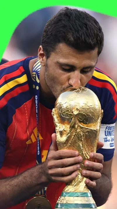 Spain's Rodri kisses the World Cup trophy