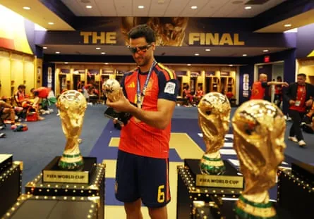 Mikel Merino holds a replica of the trophy.